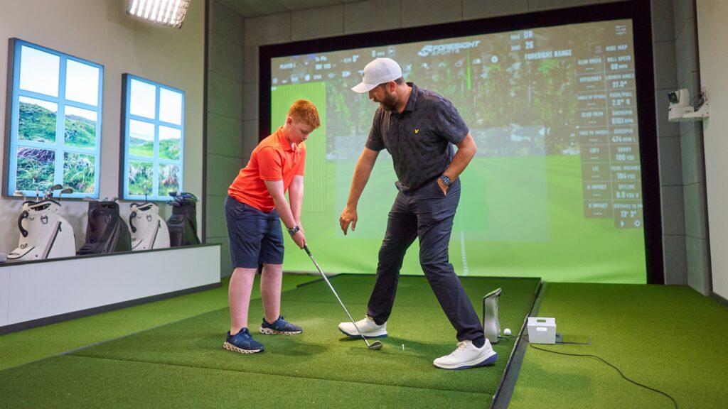 Rick Shiels gives fan Jack,13, some pointers during his memorable visit to the H.I.T studio